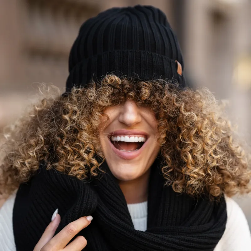 Women's Ribbed Beanie Knitted Merino in black color.