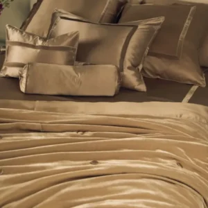 Kumi Kookoon silk velvet boudoir pillow sham in champagne on styled bed.